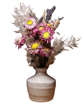 fancy ceramic flower vase holding purple and yellow flowers
